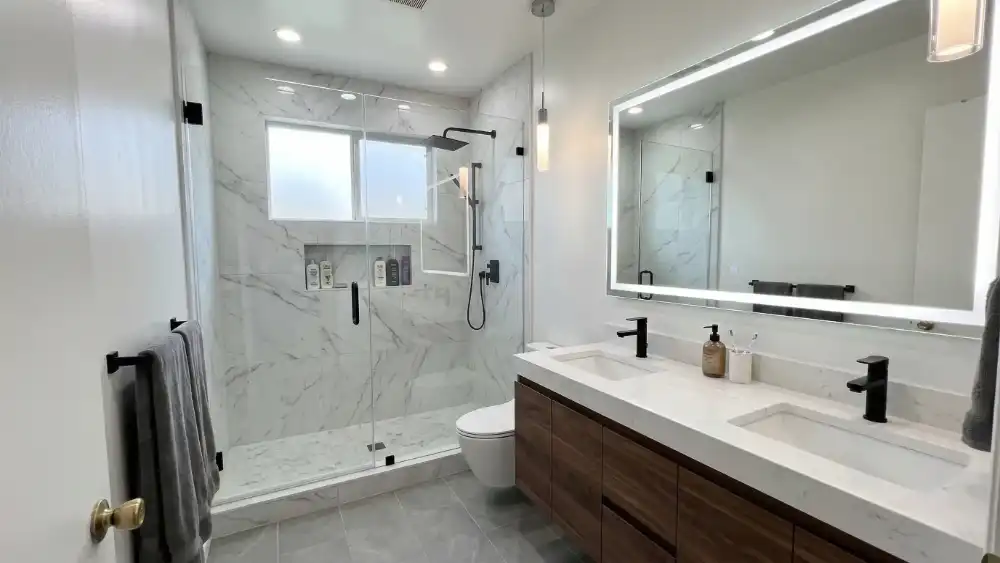 2-BATHROOM-REMODEL-AFTER-LOSANGELES modern bathroom remodel with glass shower and double vanity
