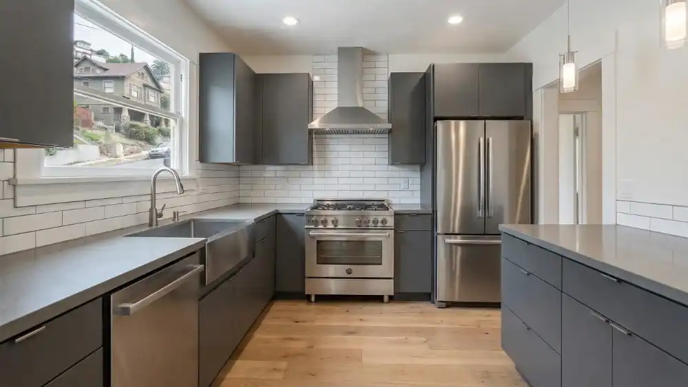 2-KITCHEN-REMODEL-AFTER-LOSANGELES Modern kitchen after renovation with new cabinets, countertops, and stainless steel appliances